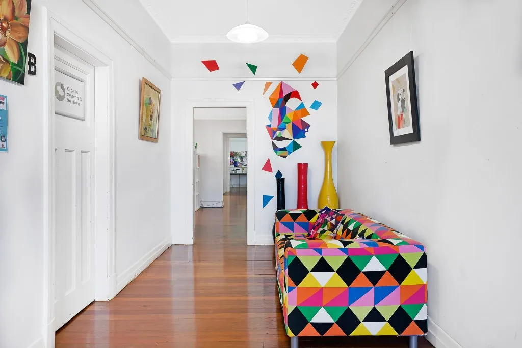 Hallway at Salt Space Coworking with a colourful lounge seat